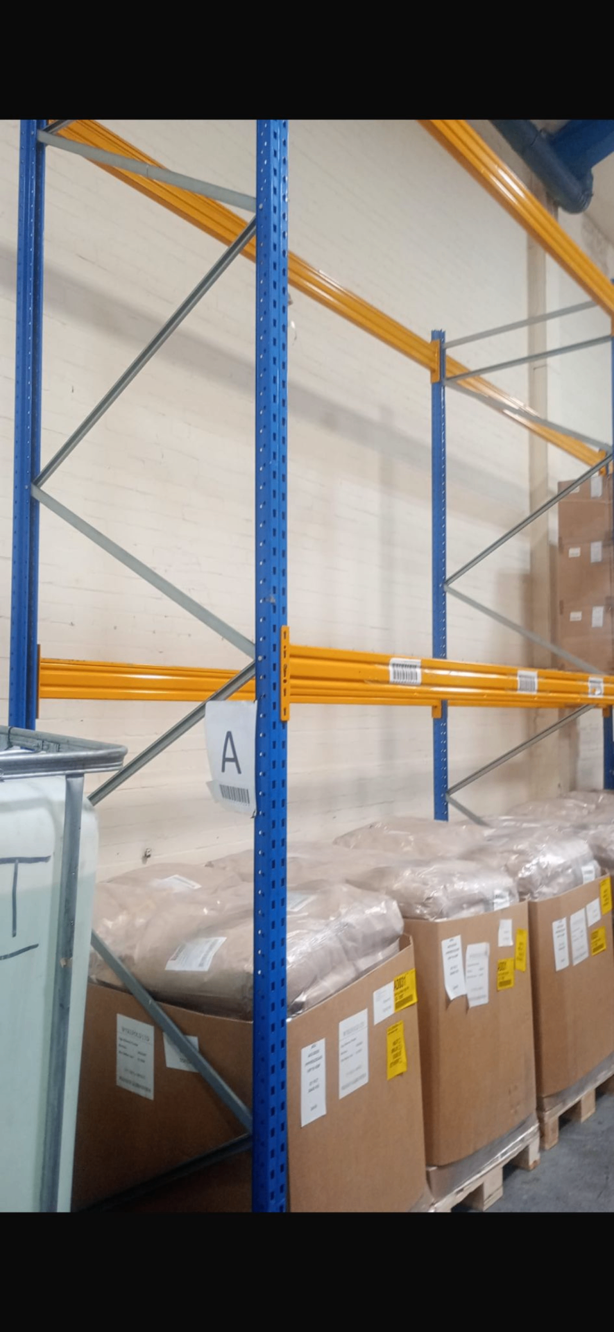 Used Pallet Racking For Sale UK - Close up of Esmena APR uprights and orange beams | UM Storage Systems