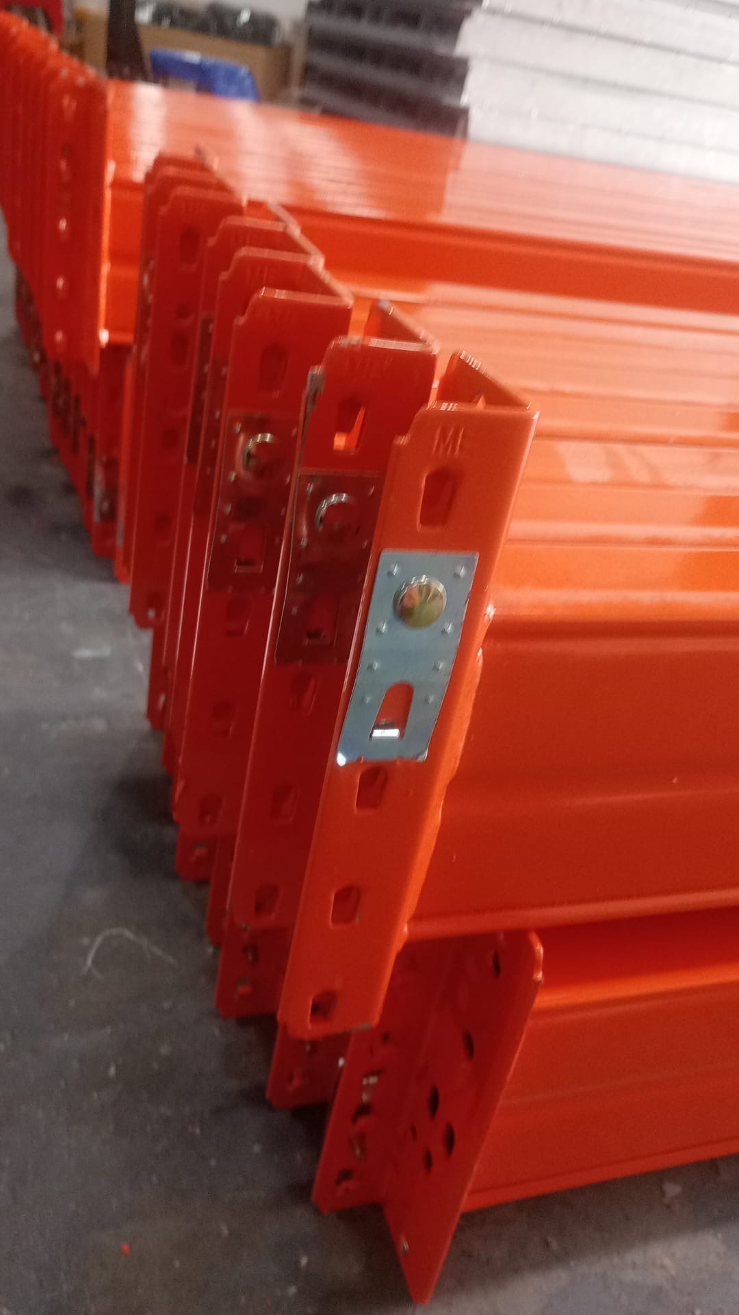 Used Pallet Racking Newport Wales - Orange beams stacked on site | UM Storage Systems